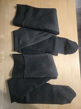Set Of 2 NWOT Black lined tights with a cream lining Medium size
